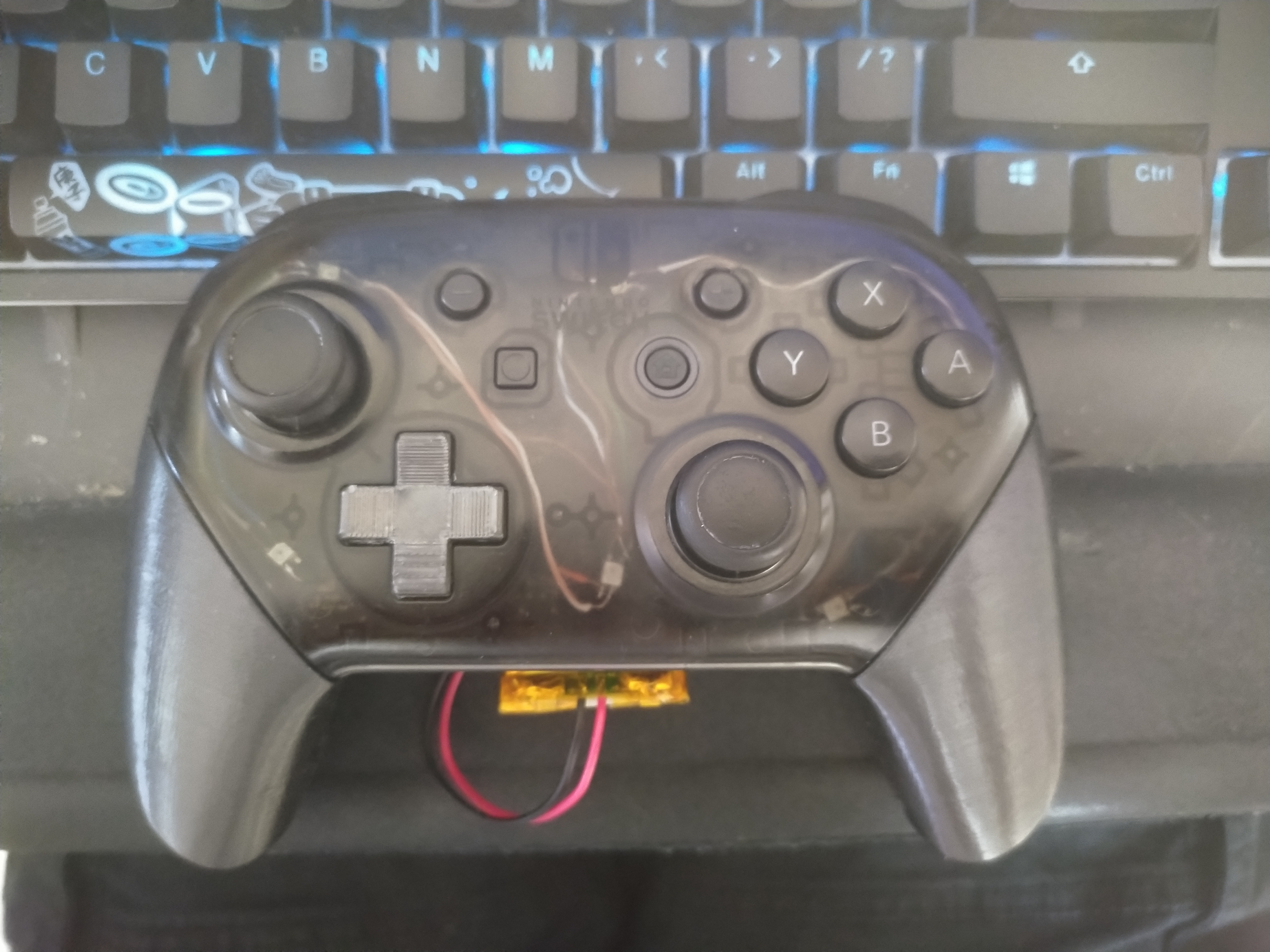 Image of the front of the controller with LEDS off, showing the wiring through the faceplate